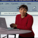 Female narrator looking into the camera with a webpage background.